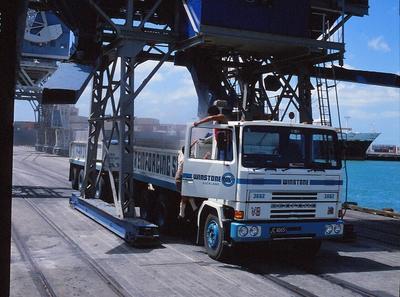 Winstone Refractories Ltd: 1973 Huntly plant, North Waikato - Winstone Bedford truck #3662 under hopper wharfside