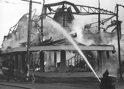 C & A Odlin Timber & Hardware Co Ltd: 1963 Napier Branch, Kennedy Rd, Hawke's Bay ablaze with fire which destroyed the building; 1963; Photograph
